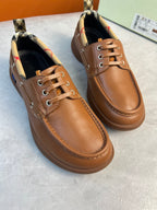 Burberry brown leather lace-up boat shoes with checkered lining at the collar and low-profile sole