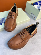Burberry brown leather lace-up boat shoes angled view with checkered lining and lace-up front