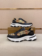 Burberry lace-up sneakers pair view, black with beige plaid panels and gold emblem