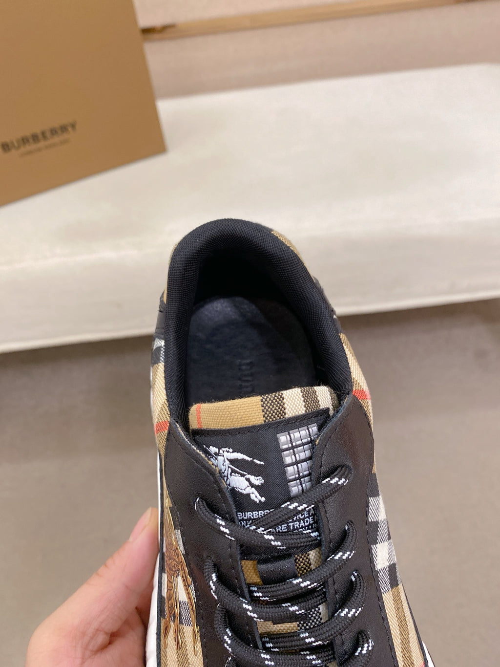 Burberry lace-up sneakers, close-up of tongue and laces with plaid lining