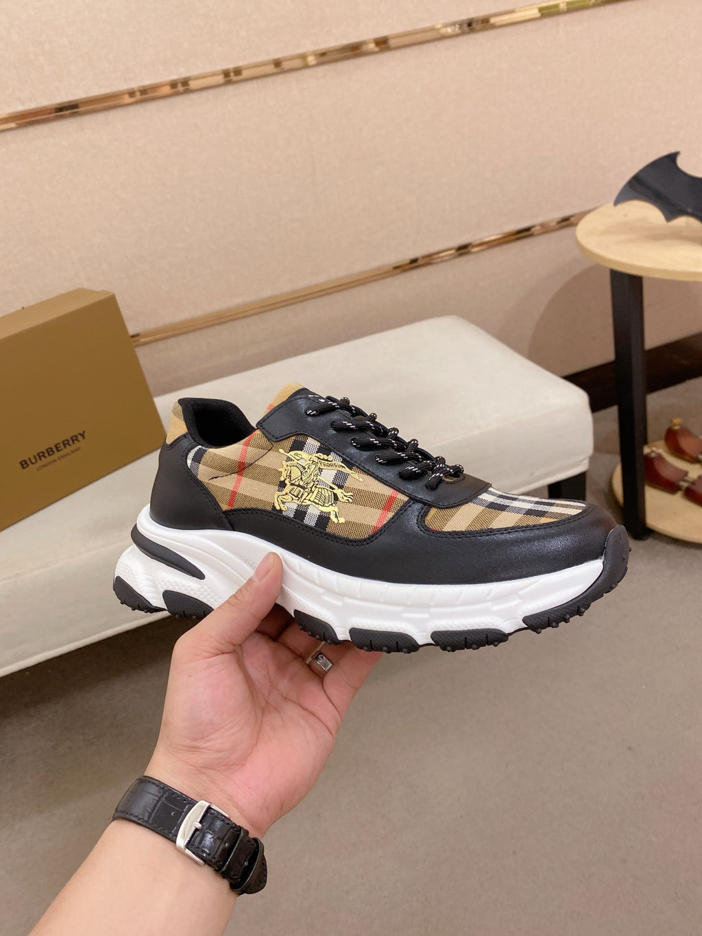 Burberry lace-up sneakers side view, black uppers with plaid panel and thick white sole