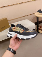 Burberry lace-up sneakers side view, black uppers with plaid panel and thick white sole
