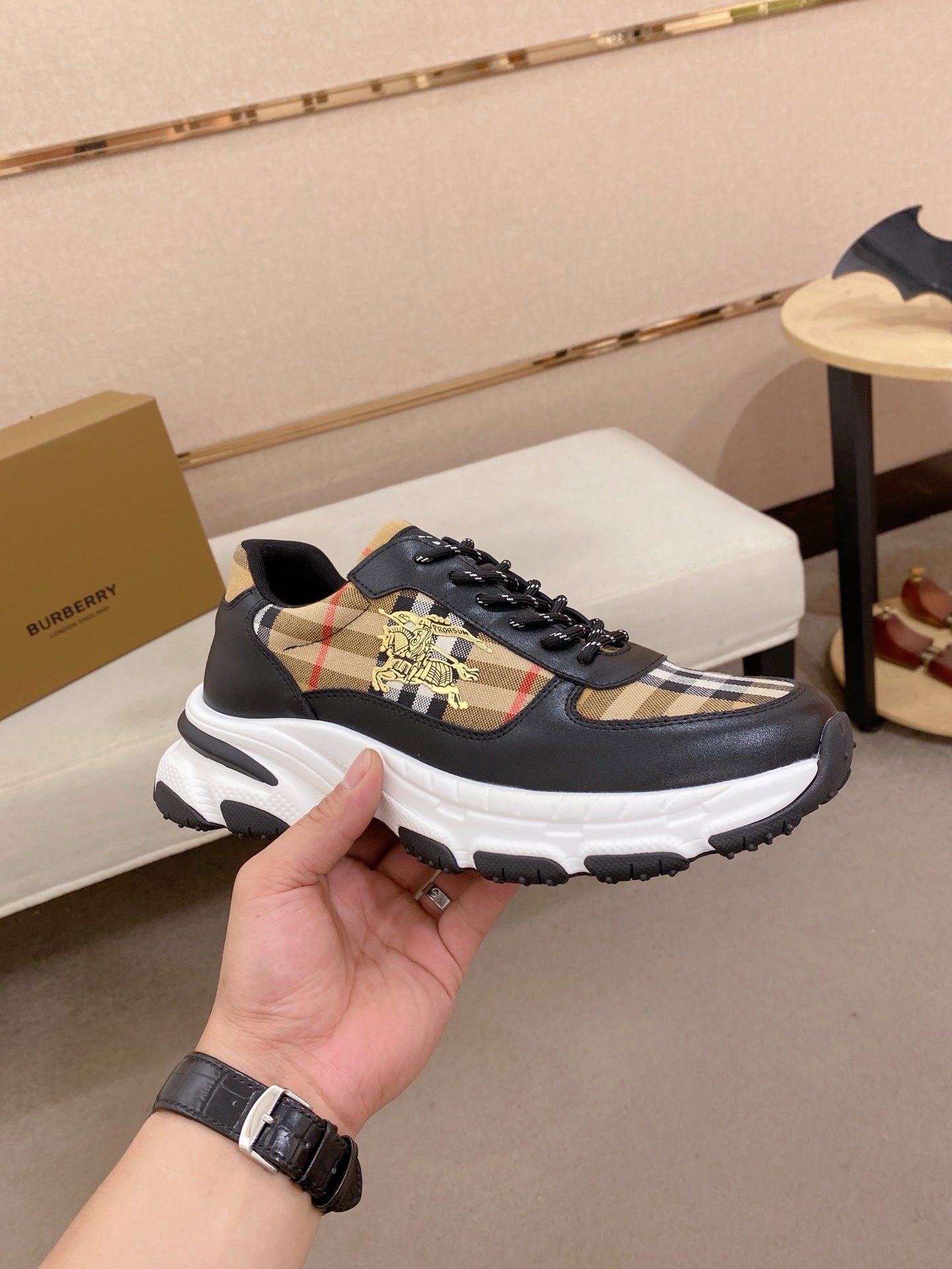 Burberry lace-up sneakers side view, black uppers with plaid panel and thick white sole