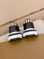 Burberry sneakers back view, black uppers with plaid heel detail and white midsole