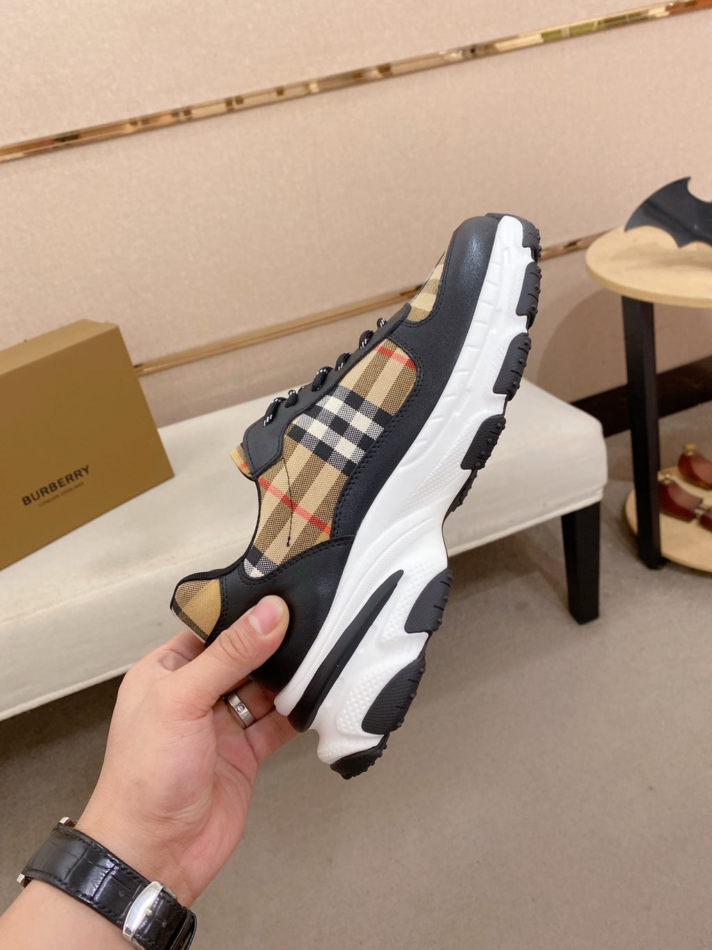 Burberry lace-up sneakers, heel and side view with plaid inserts and molded sole tread