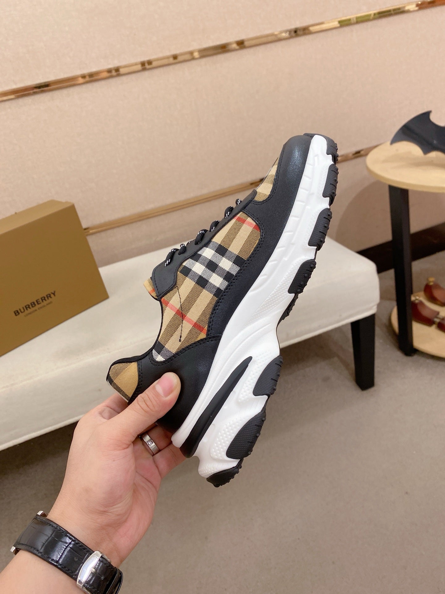 Burberry lace-up sneakers, heel and side view with plaid inserts and molded sole tread