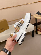 Burberry luxury sneakers, side profile with plaid insert and thick rubber sole
