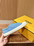 Fendi unisex low-top sneakers held in hand, light blue suede with white rubber sole