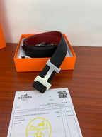 Hermes reversible belt in dark leather with silver H buckle, burgundy side visible
