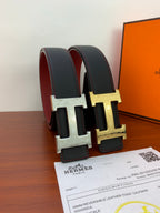 Hermes belt pair look: dark textured straps with silver and gold H buckles