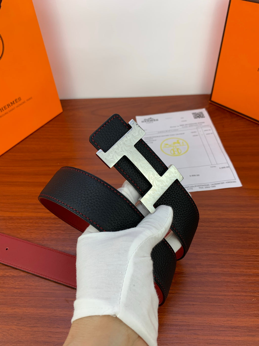 Hermes leather belt, black strap with gold H buckle and red stitching