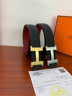 Hermes belt with gold buckle: black leather straps with red inner lining
