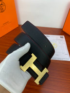 Hermes leather belt, black strap with gold H buckle and wide end