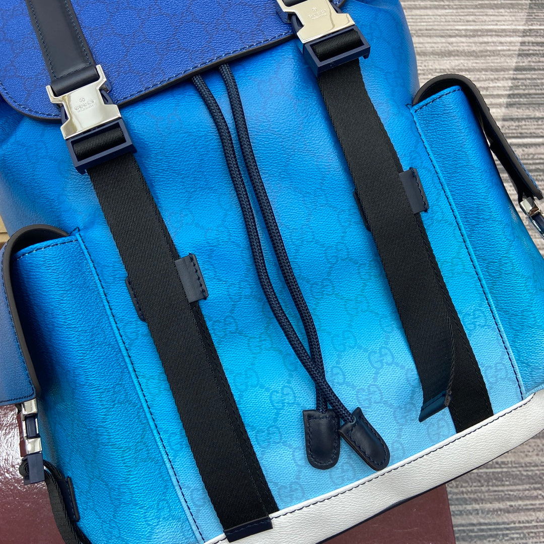 Gucci men’s backpack exterior with bright blue leather, black straps, and white border