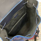Open Gucci backpack interior with olive lining, inner pockets and drawstring cords