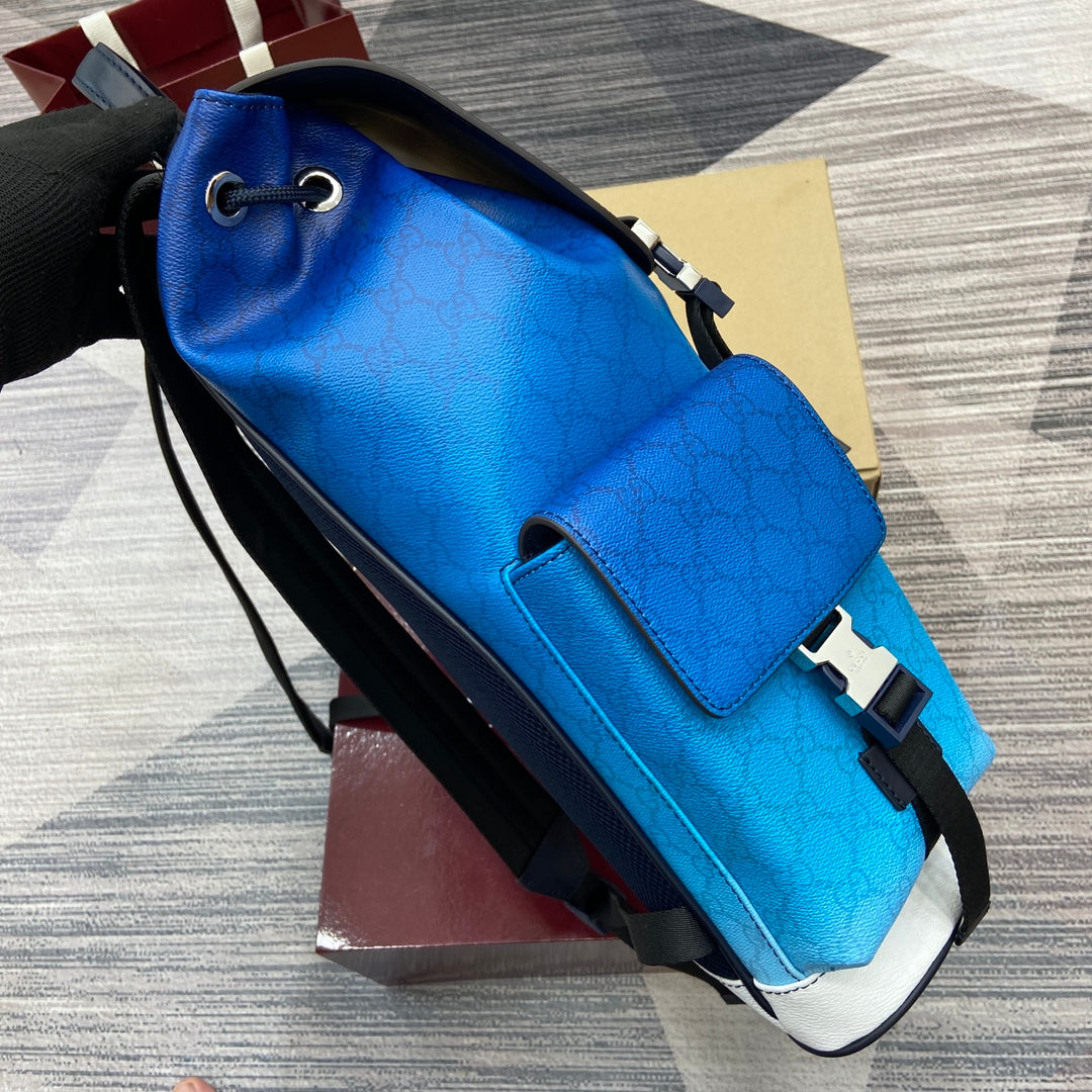 Gucci men’s backpack crossbody style in bright blue leather with flap and black trim