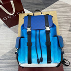 Gucci men’s backpack in bright blue leather with black straps and white trim