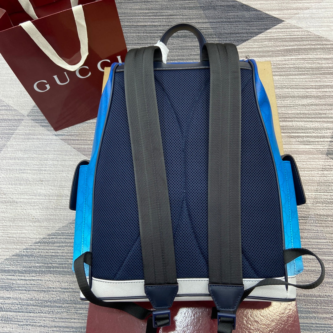 Gucci men’s backpack back view with black shoulder straps and blue textured panel