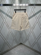 Cream elastic-waist shorts with side pockets