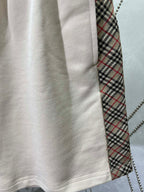 Cream shorts hem with stitched seam and inner plaid lining