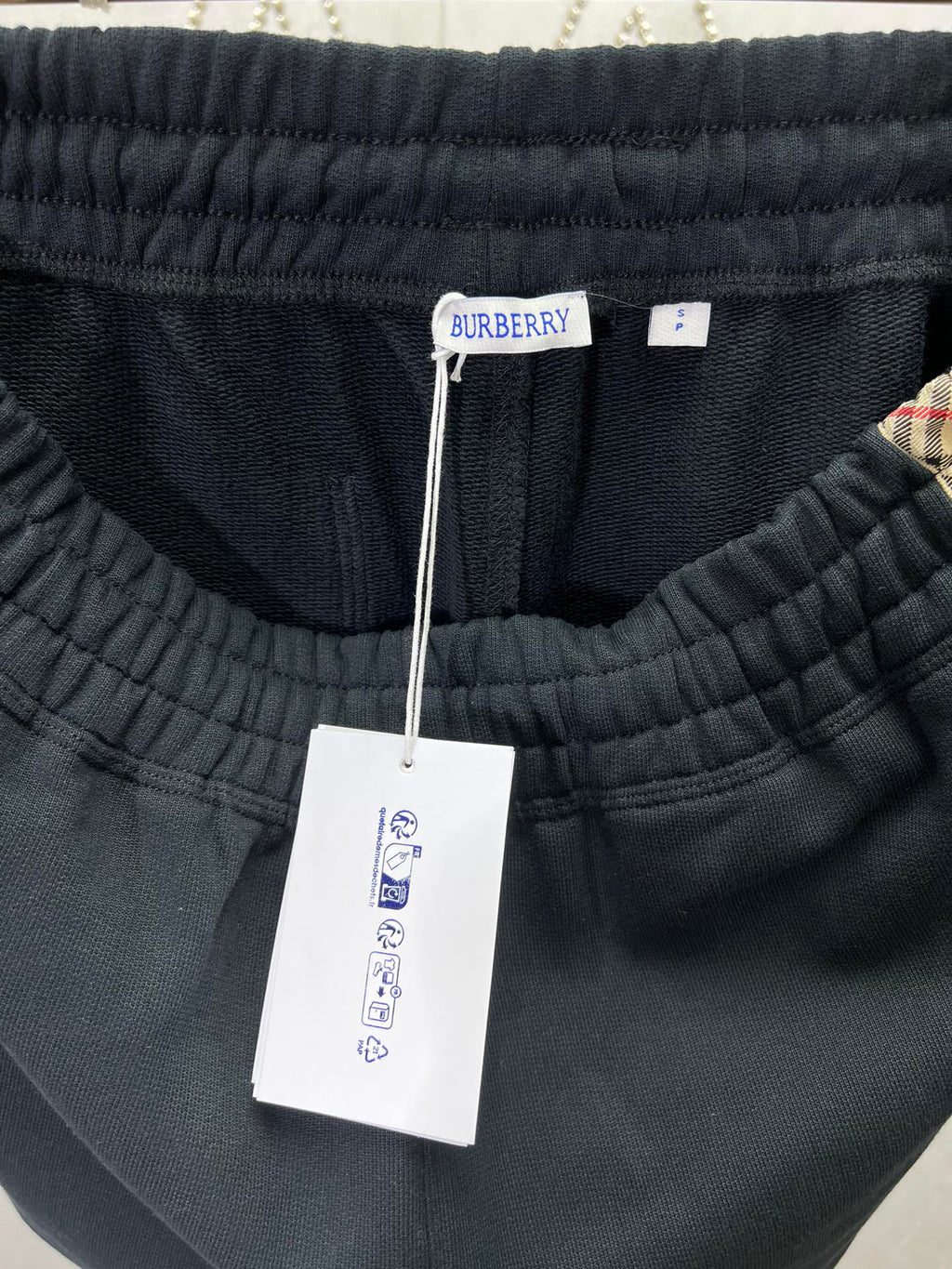 Navy shorts with elastic waistband and attached brand tag