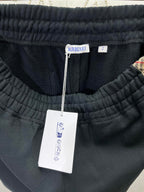 Navy shorts with elastic waistband and attached brand tag
