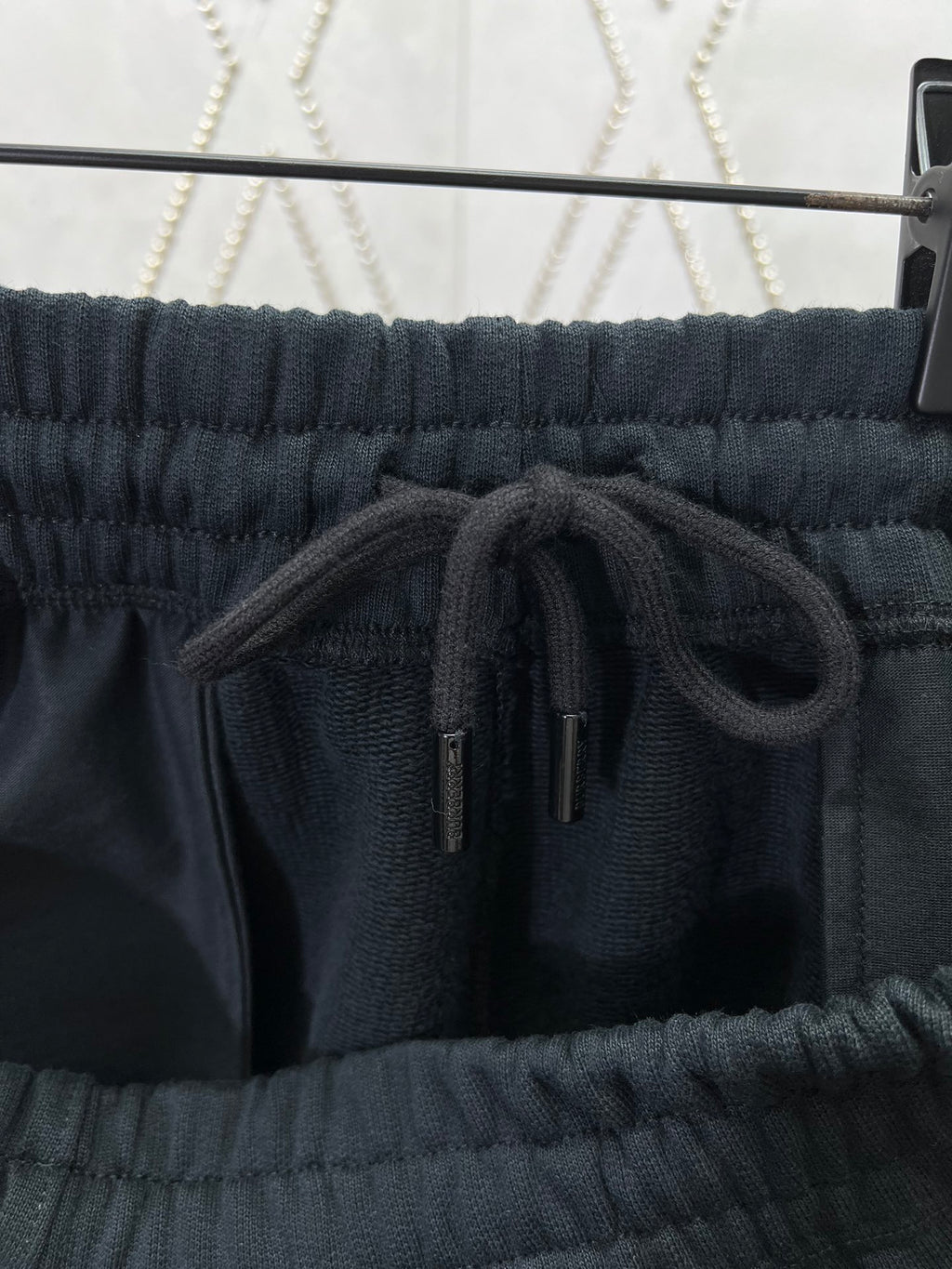 Navy drawstring shorts with elastic waistband and drawcord
