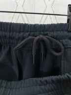 Navy drawstring shorts with elastic waistband and drawcord