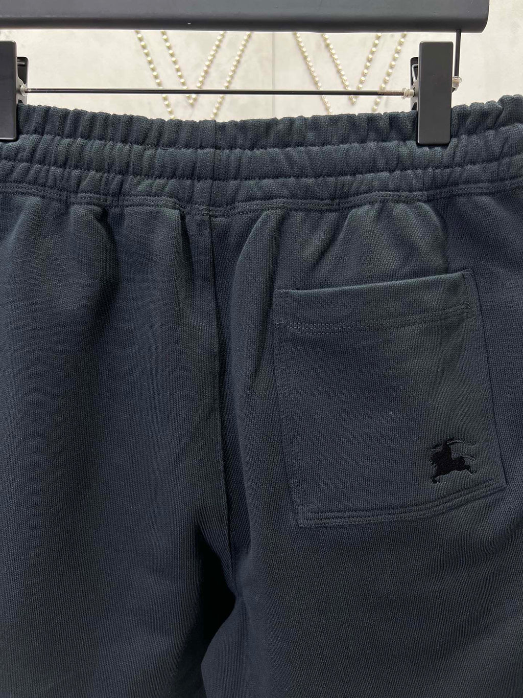 Navy shorts with elastic waistband and front welt pocket