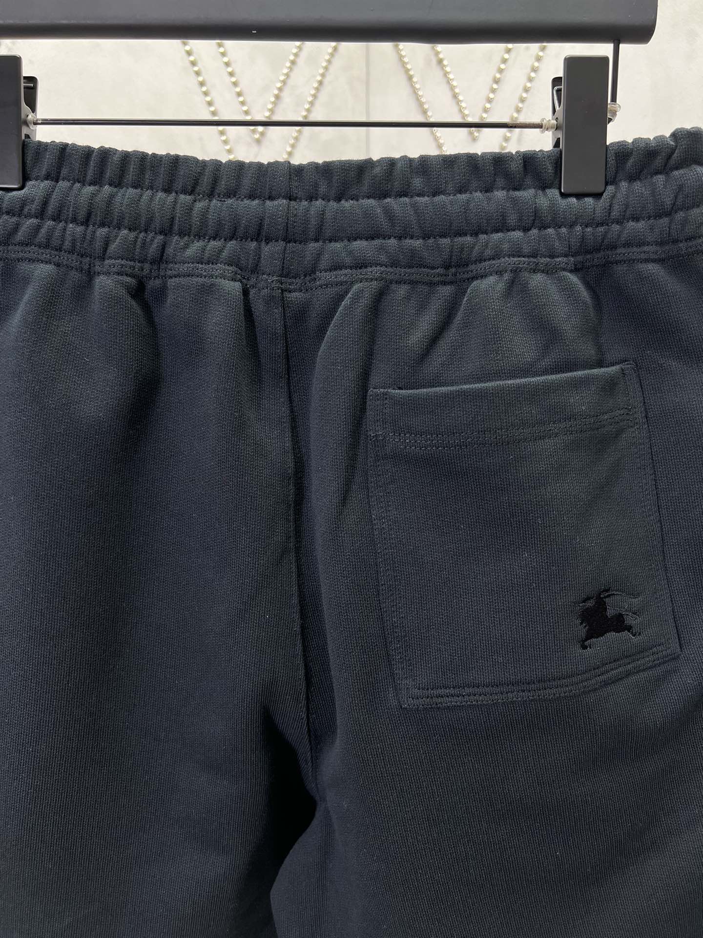 Navy shorts with elastic waistband and front welt pocket