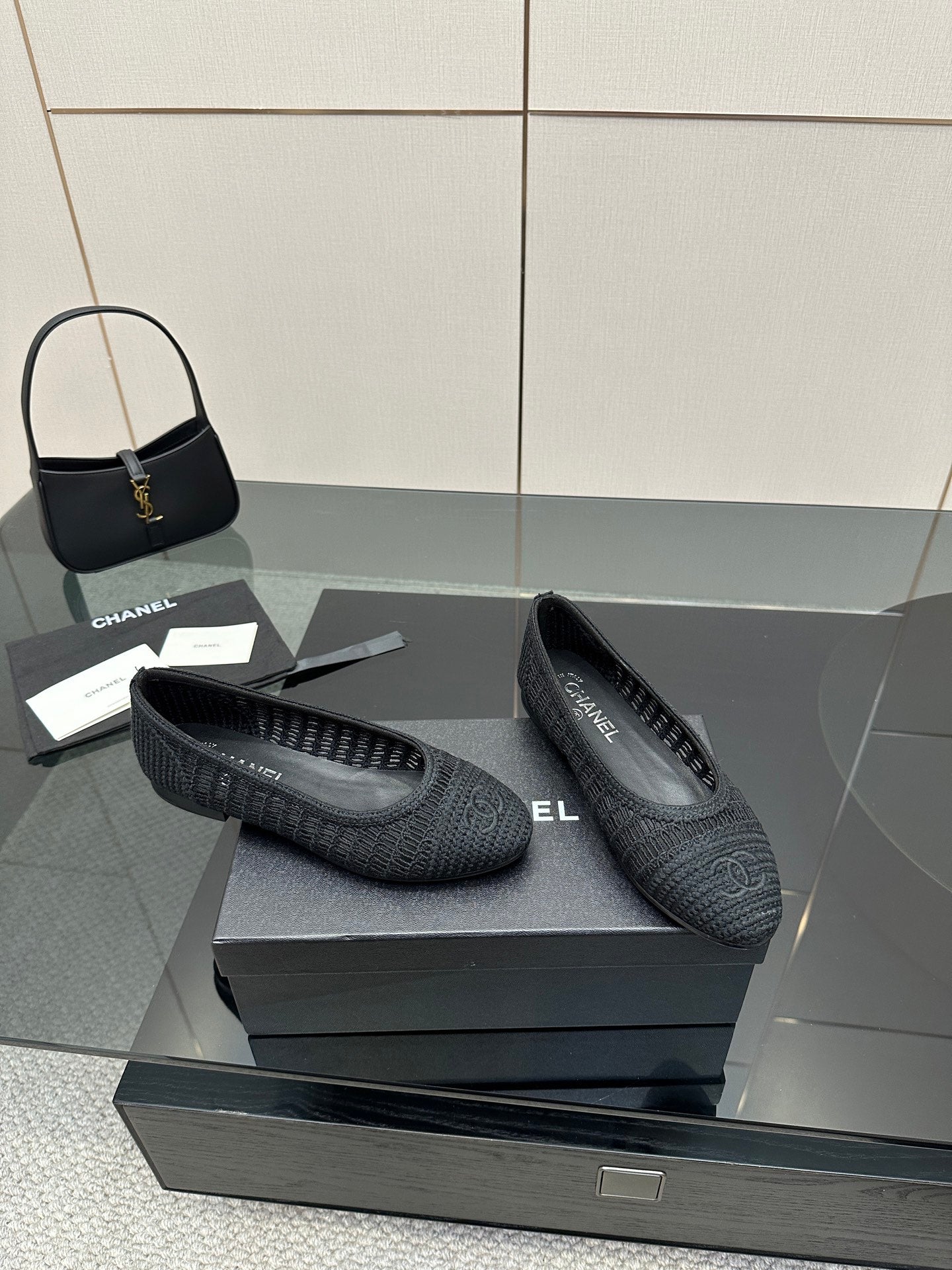 Women’s Chanel dark gray knit ballet flats, side view with woven texture and low heel