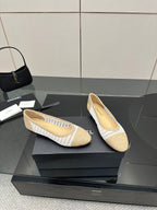 Chanel ladies woven ballet flats, side view pair, cream with white stripe trim