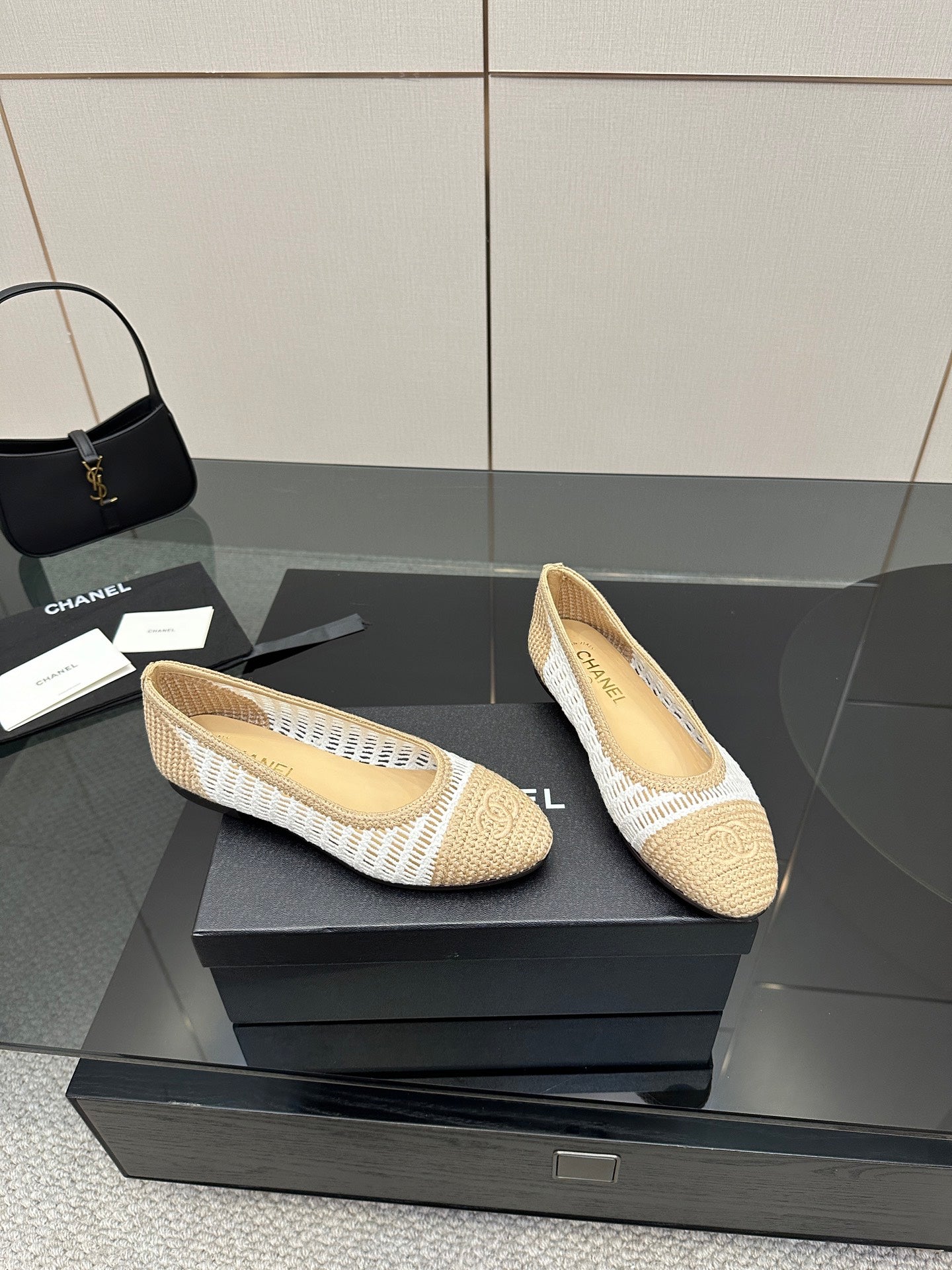 Chanel ladies woven ballet flats, side view pair, cream with white stripe trim