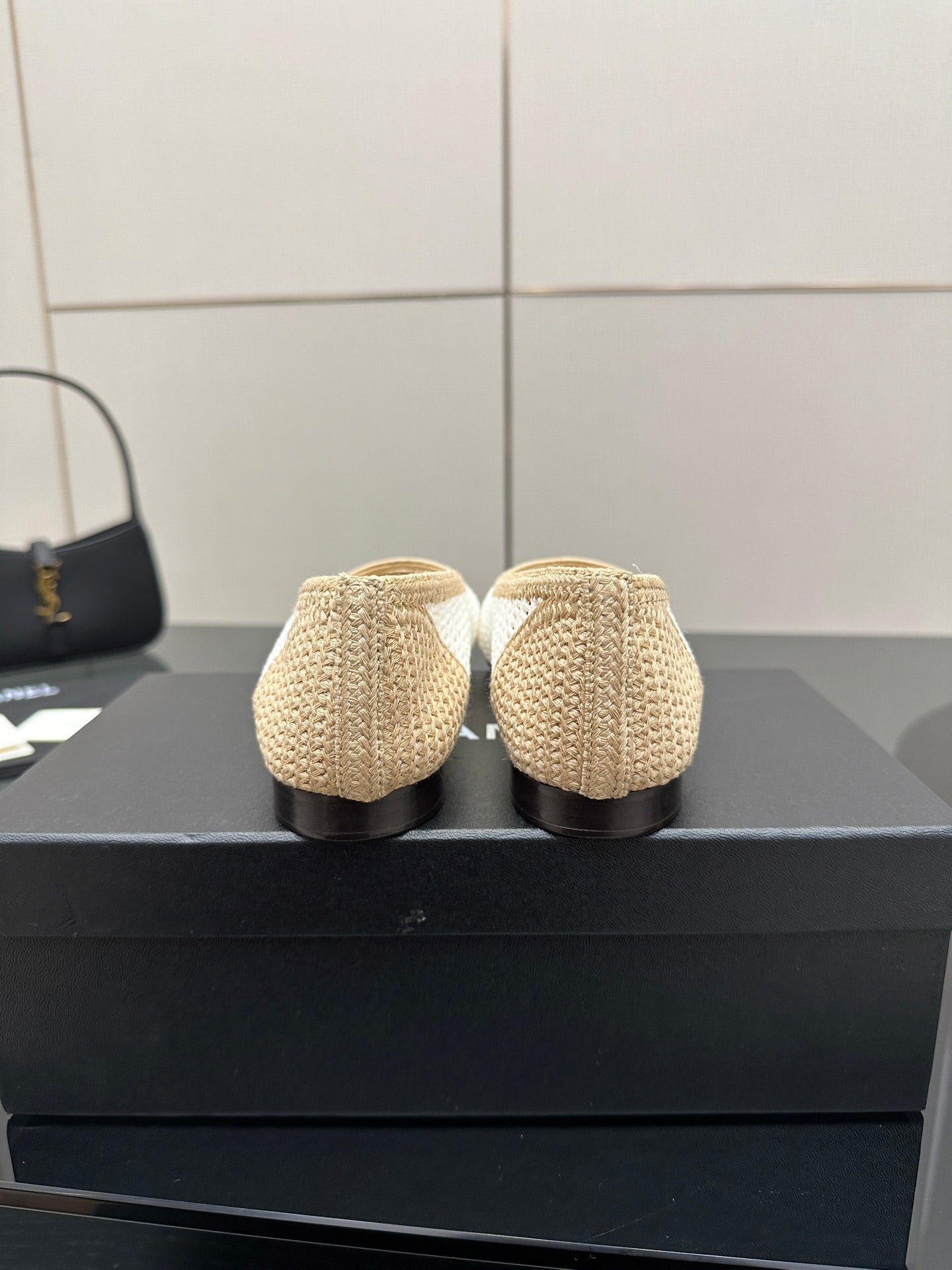 Chanel ladies woven ballet flats, rear view of heels, cream with white trim