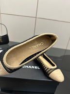 Chanel ladies ballet flats, close-up of beige knit upper and CHANEL branding on sole
