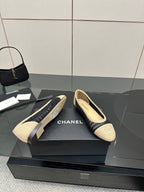 Chanel ladies ballet flats, pair shown on box with beige toe and navy knit sides