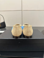 Chanel ladies woven flats rear view, beige knit with blue trim at heel