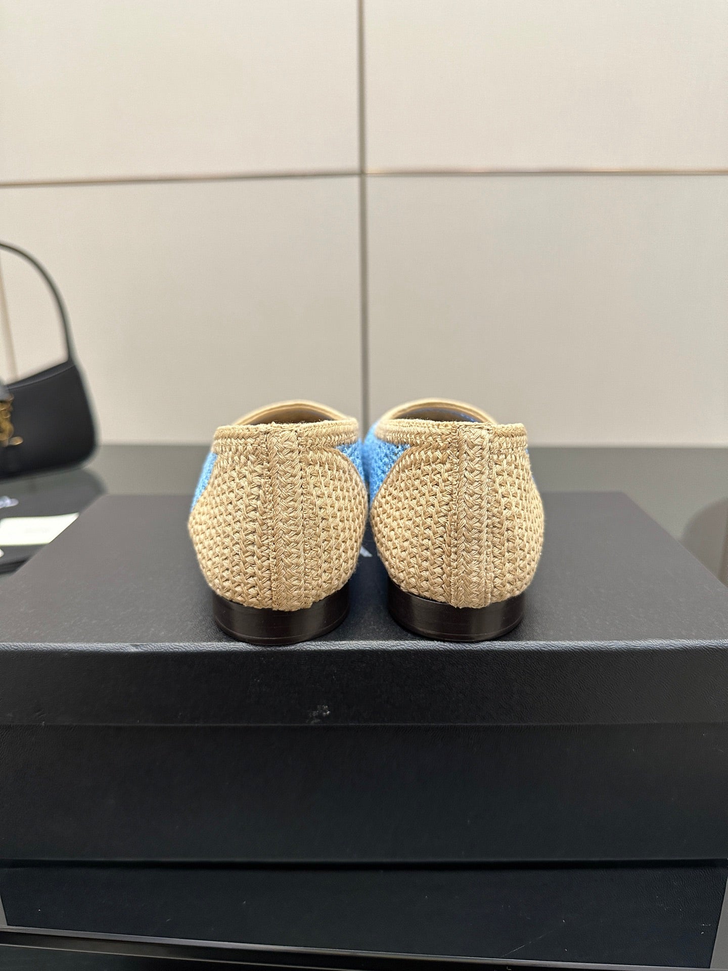 Chanel ladies woven flats rear view, beige knit with blue trim at heel