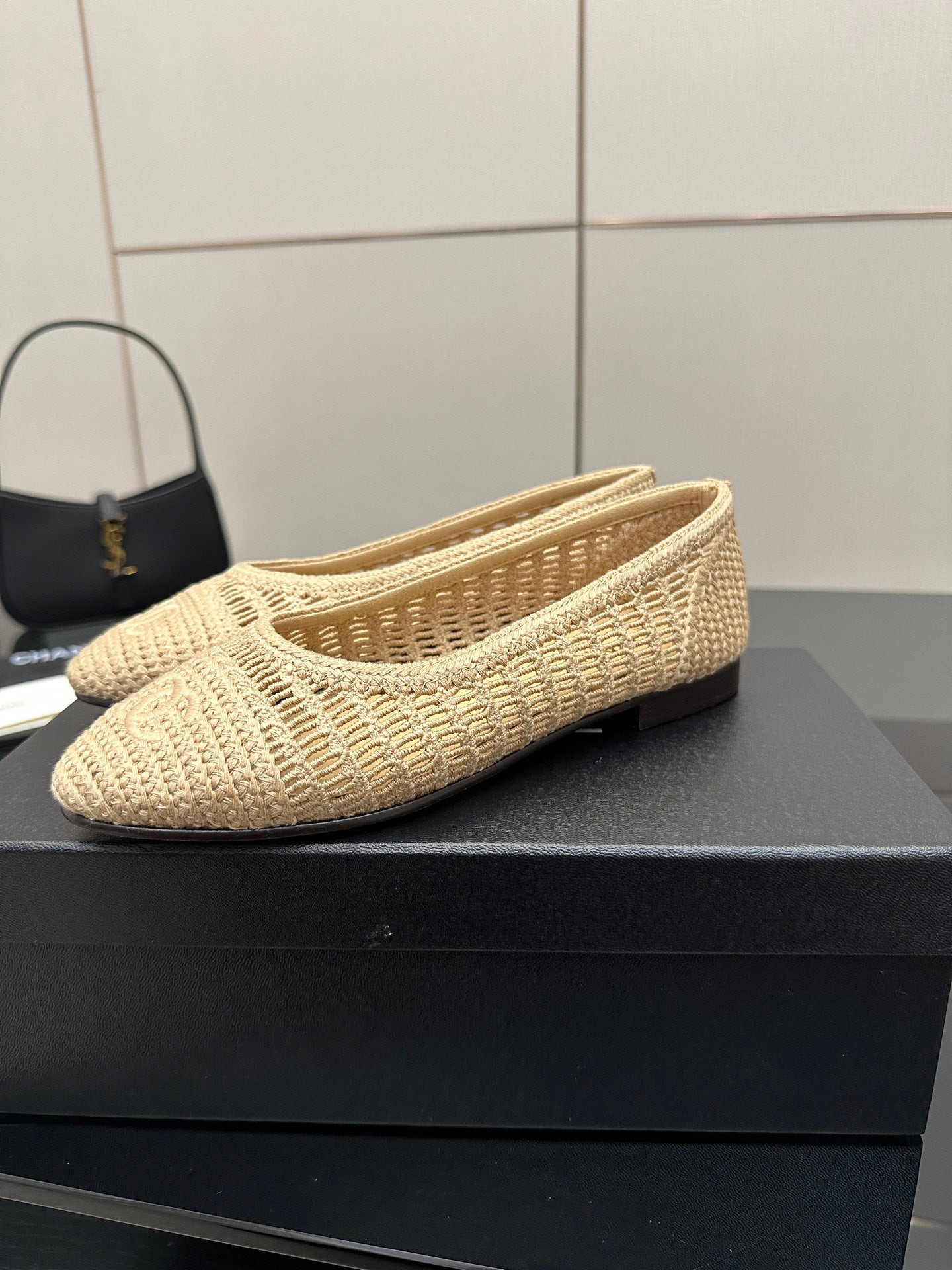 Chanel women’s light beige woven slip-on flats with flat heel and textured pattern