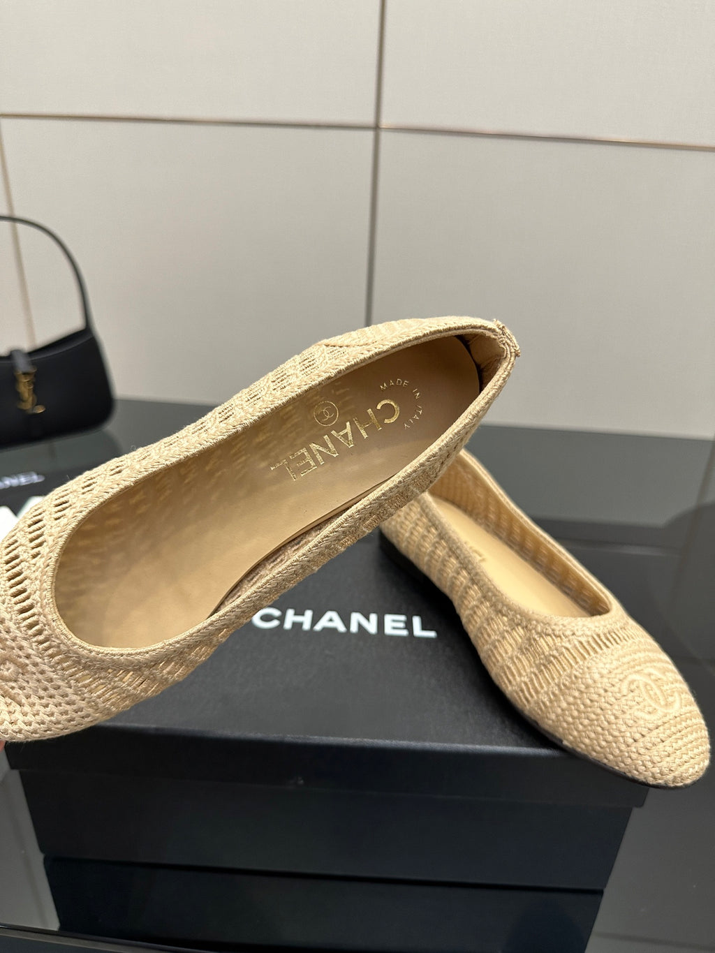 Chanel women’s woven flats, light beige slip-on style with “Chanel” logo lining