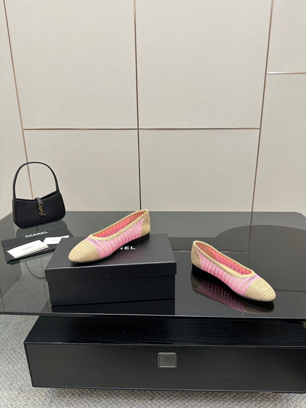 Women's Chanel ballet flats, beige and pink woven design, one shoe facing left