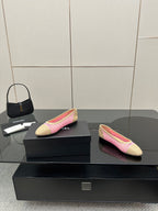 Women's Chanel ballet flats, beige and pink woven design, one shoe facing left