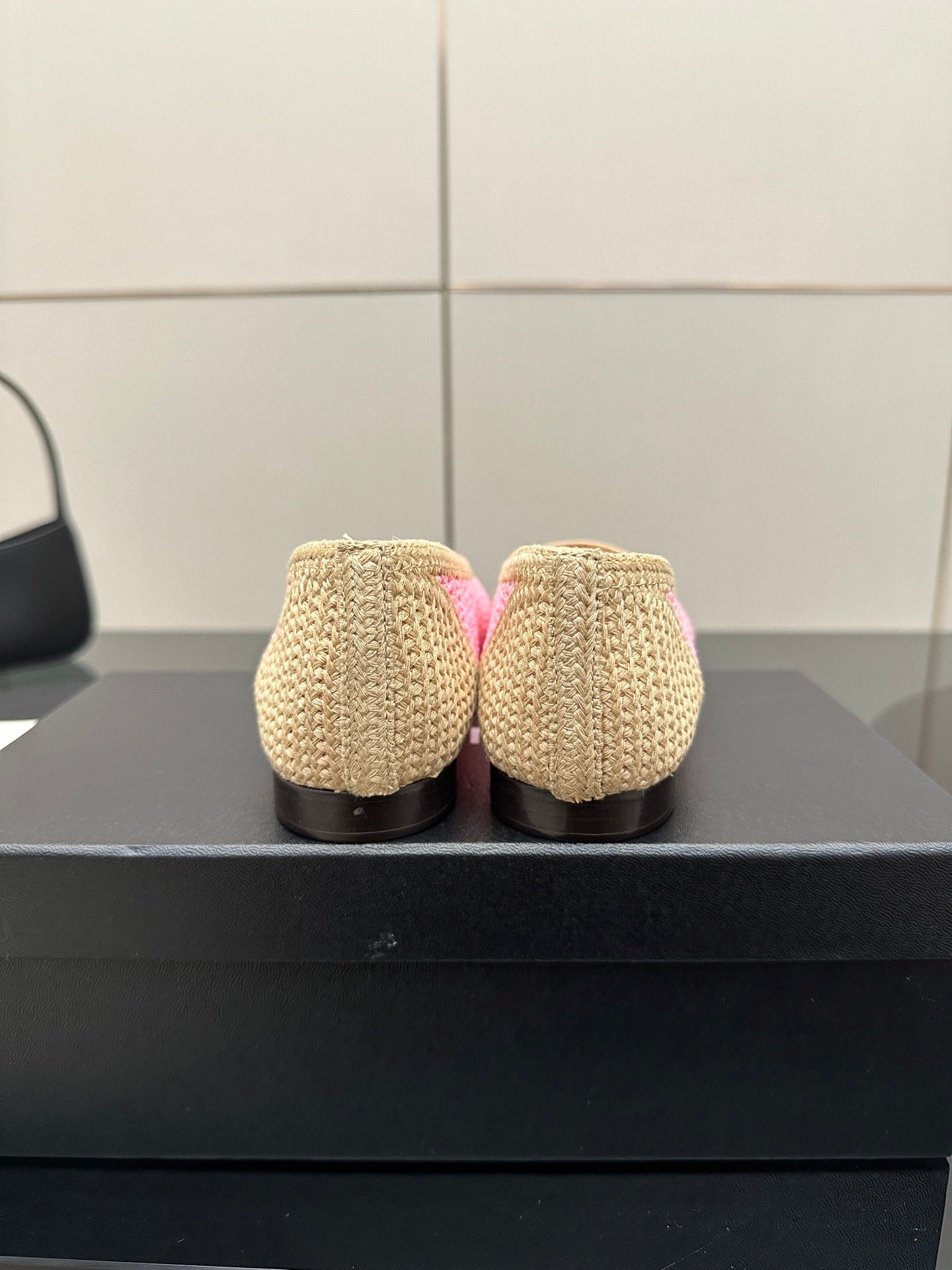 Women's Chanel ballet flats, beige woven backs with low heels, rear view