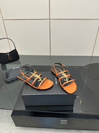 Women's strappy slide sandals, orange footbed with black straps and yellow-green cord trim