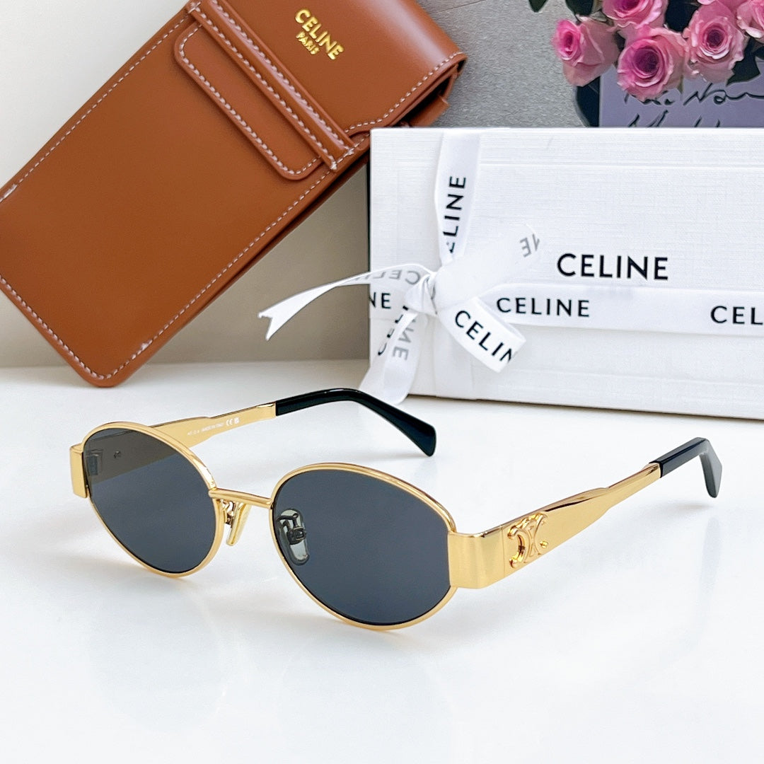 Celine sunglasses with gold frame and round dark blue lenses, with black temples