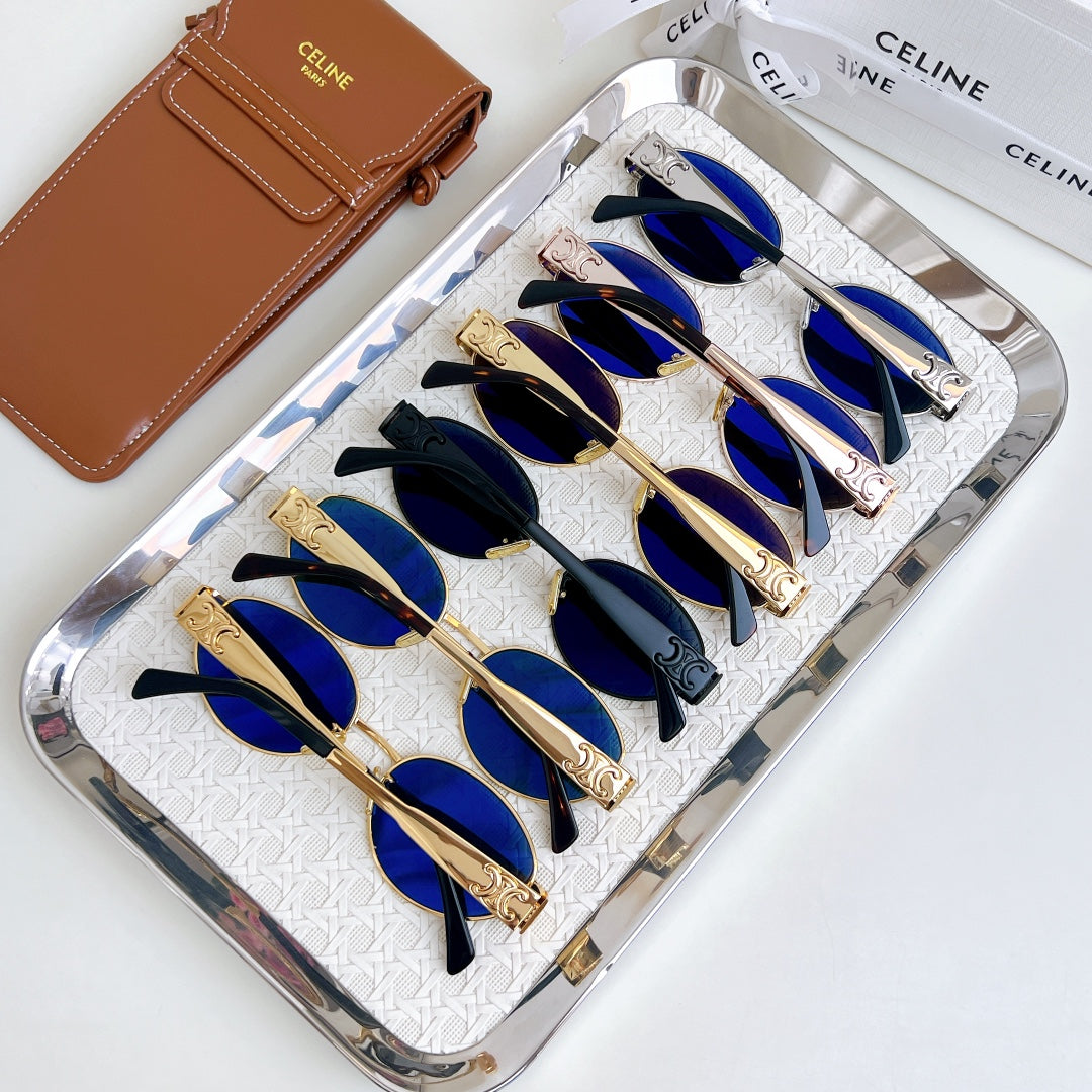 Celine sunglasses set in a clear case, featuring multiple blue-tinted round lenses