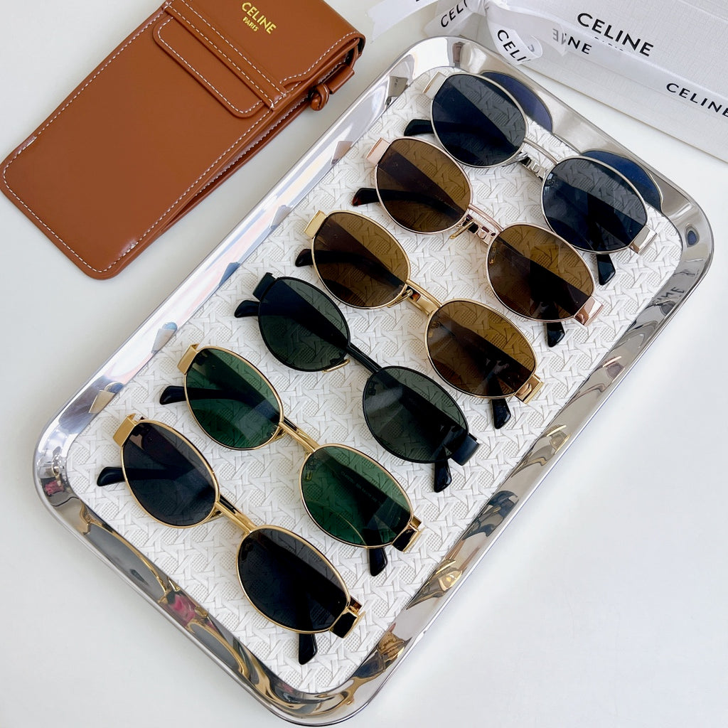 Celine sunglasses set in a clear case, featuring green and dark round lenses