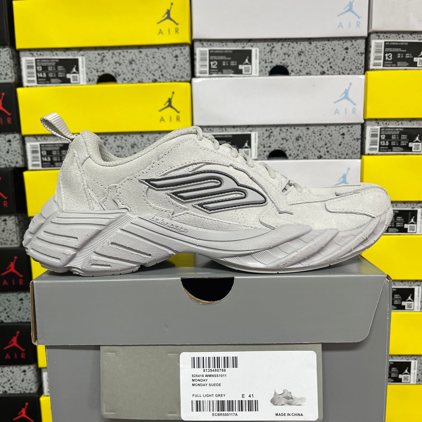 Light gray unisex running sneaker side view with lace-up, padded collar, and sculpted sole