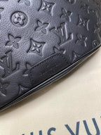 Men’s Louis Vuitton dark navy monogram belt bag close-up of embossed pattern