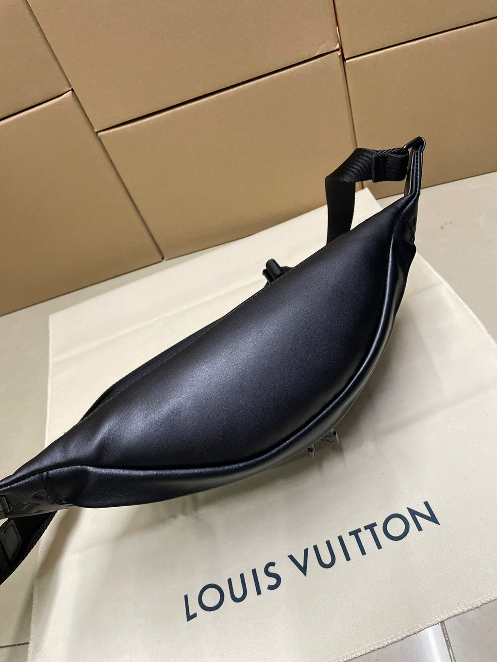 Men’s Louis Vuitton dark navy monogram sling bag with smooth leather-like base